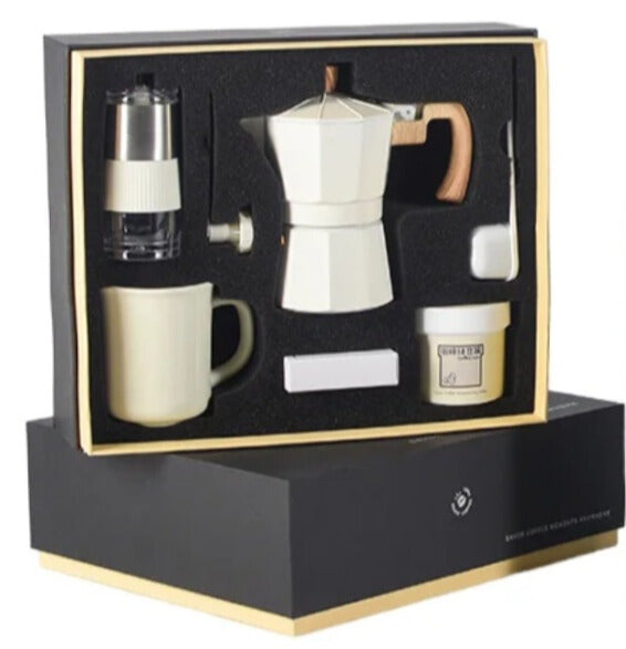 Luxury white coffee maker set with hand grinder and accessories.